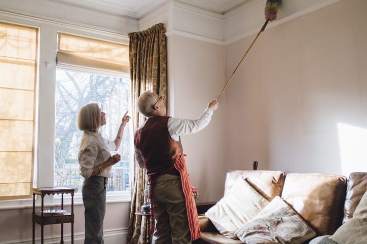 elderly couple spring cleaning