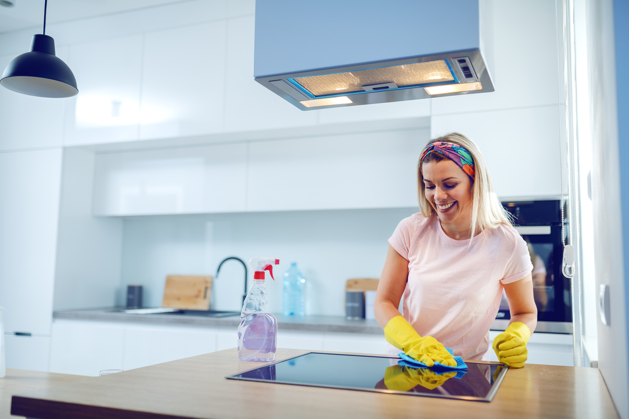 woman cleaning surfaces