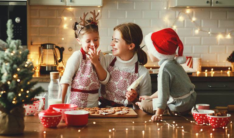 woman baking with her kids